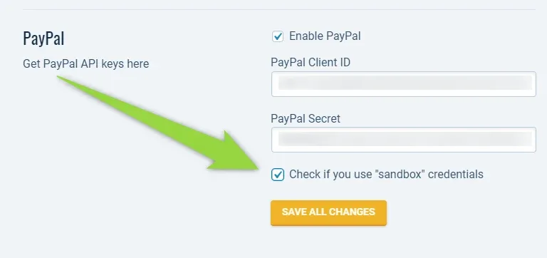 The PayPal block of the Monetization settings with an arrow pointing at the ticked "Check if you use sandbox credentials" checkbox, below the PayPal Client ID and PayPal Secret fields and above SAVE ALL CHANGES.