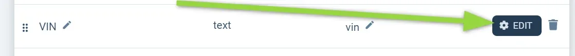 A single row in the Custom Fields list — name VIN, type text, slug vin — with a green arrow pointing at its EDIT button