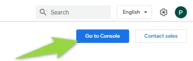 Top-right of the Google Maps Platform site with a search box, English language selector, settings gear and account avatar; a green arrow points at the blue "Go to Console" button beside "Contact sales".