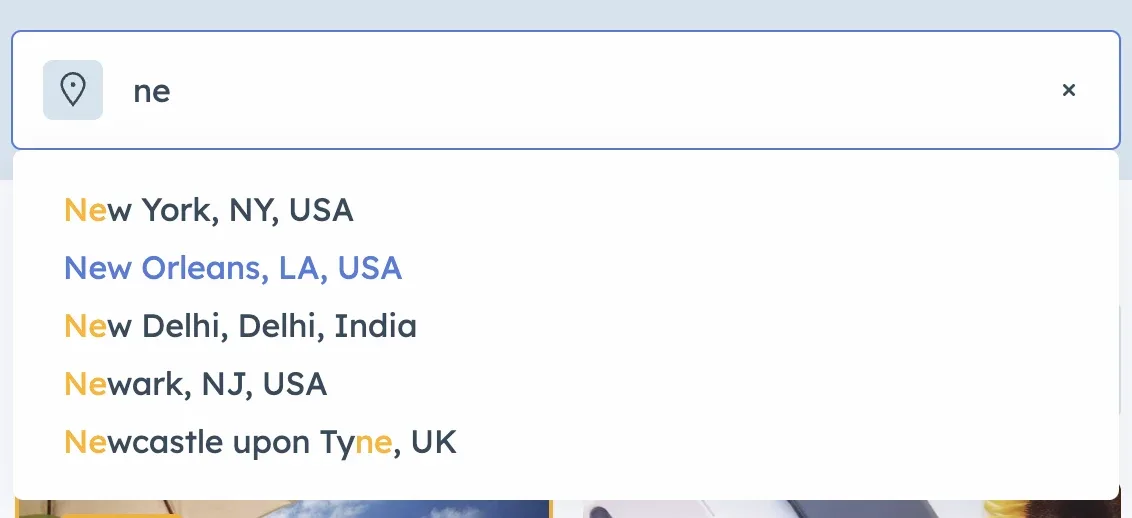 Location search box with "ne" typed in and a suggestion list underneath — New York NY USA, New Orleans LA USA, New Delhi India, Newark NJ USA, Newcastle upon Tyne UK — with the typed letters highlighted in each name.