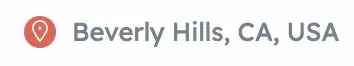 An address label with a pin icon reading "Beverly Hills, CA, USA".