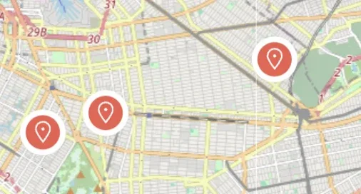 The same style of city map with three markers, each a white circle holding a red map-pin icon instead of a price.