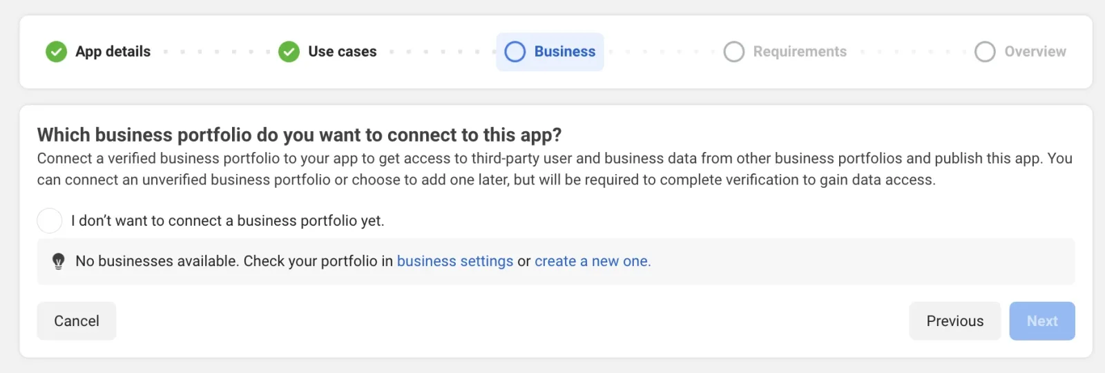 The Business step asking which business portfolio to connect, with the option “I don’t want to connect a business portfolio yet” and a note that no businesses are available, above Previous and a greyed-out Next.